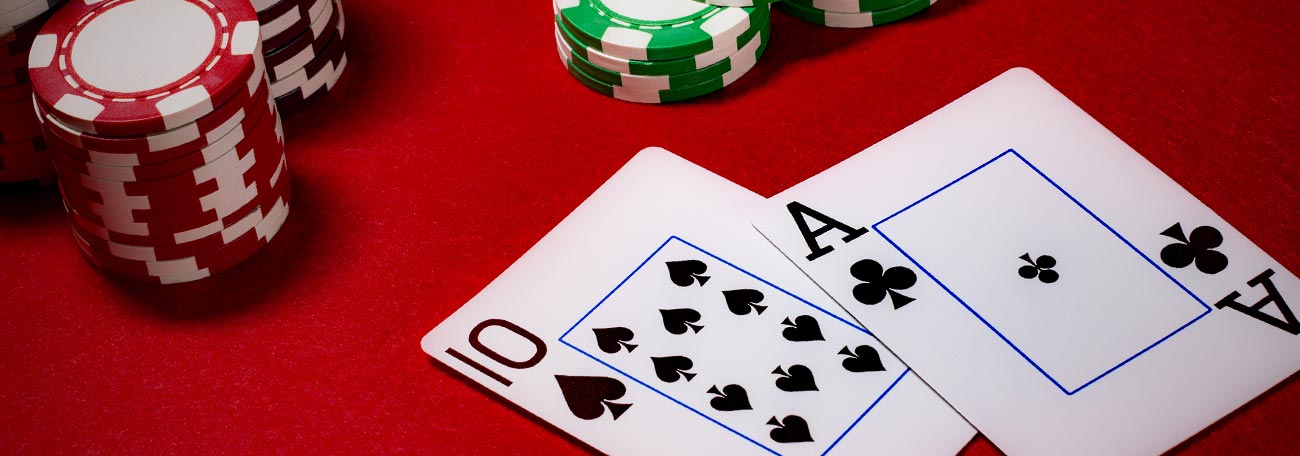 a blackjack hand of ace-10.  There are also some casino chips on the table.